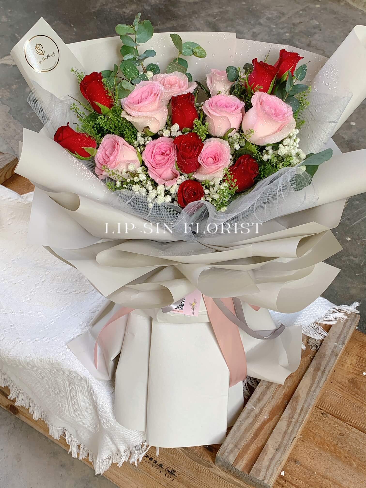 Handcrafted pink and red rose bouquet by Lip Sin Florist